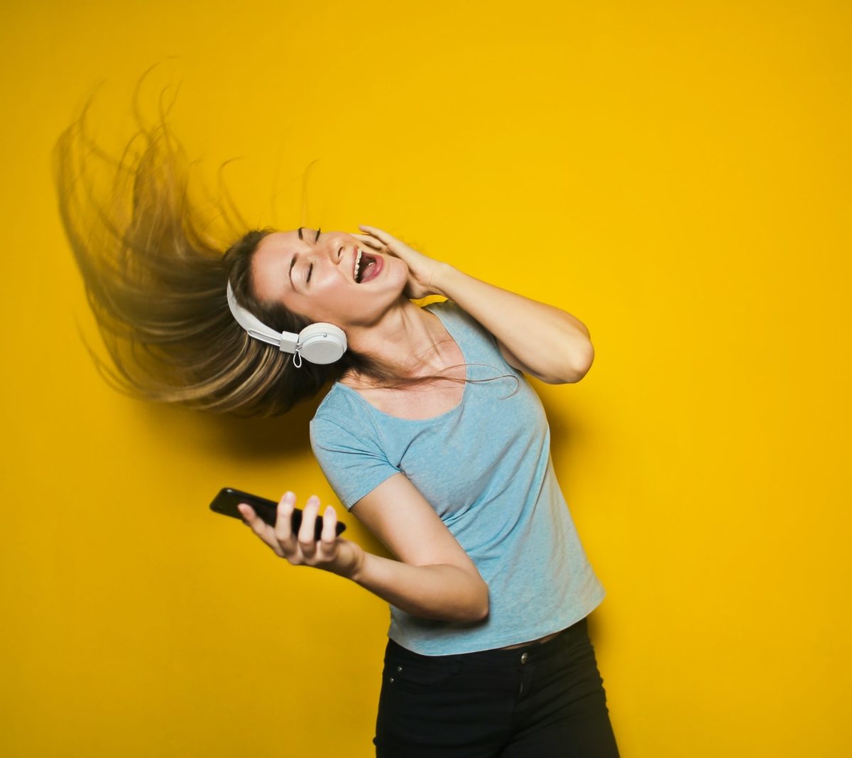 woman wearing white headphones